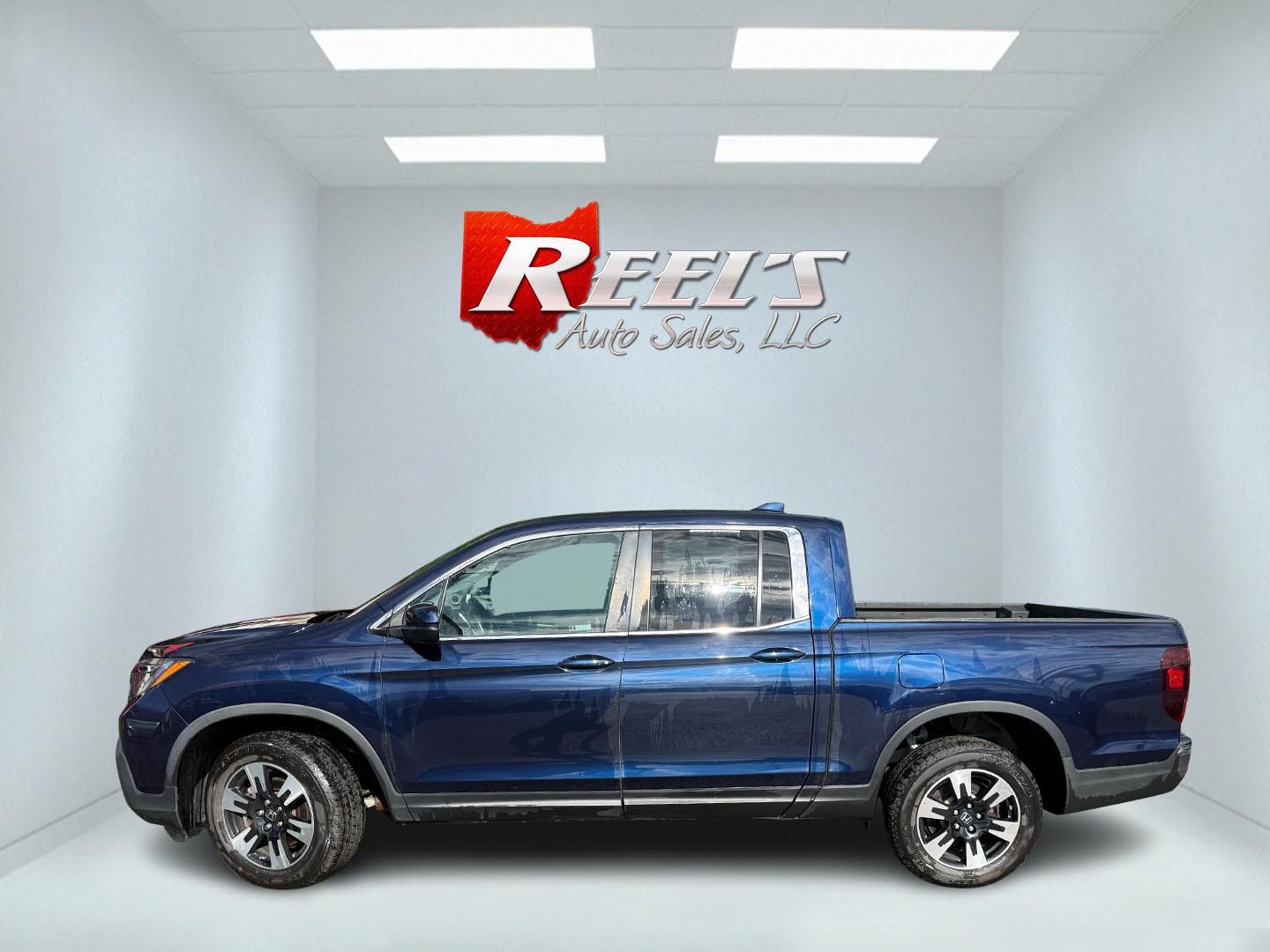 2020 Blue /Gray Honda Ridgeline RTL AWD (5FPYK3F51LB) with an 3.5L V6 SOHC 24V engine, Automatic transmission, located at 11115 Chardon Rd. , Chardon, OH, 44024, (440) 214-9705, 41.580246, -81.241943 - 2020 Honda Ridgeline RTL AWD – Unique Honda Pickup Comfort with Everyday Capability The Ridgeline is Honda’s take on a pickup — more comfortable and car-like than a traditional truck, but still useful when you need a bed and towing. This 2020 RTL AWD is a strong example. Finished in Obsidian- Photo#27