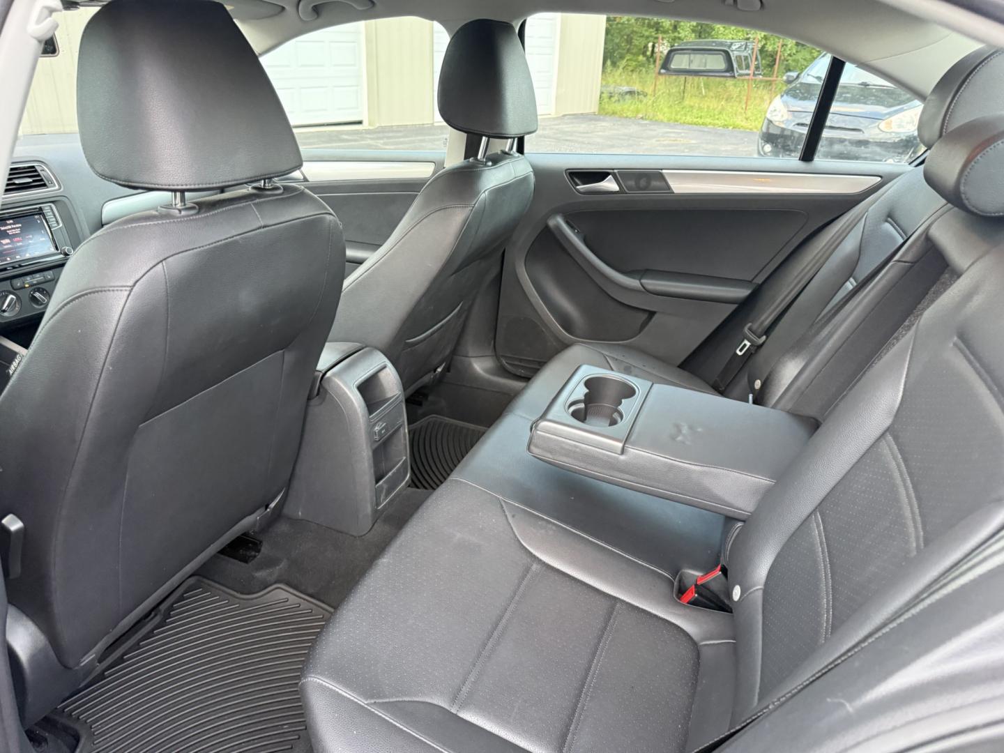 2017 Black /Black Volkswagen Jetta 1.4T SE 6A (3VWDB7AJXHM) with an 1.4L I4 DOHC 20V Turbo engine, Automatic transmission, located at 547 E. Main St., Orwell, OH, 44076, (440) 437-5893, 41.535435, -80.847855 - 2017 Volkswagen Jetta SE – Efficient German Sedan Comfort with Everyday Convenience If you want a compact sedan that feels a little more refined than a basic commuter car, this 2017 Volkswagen Jetta SE is a strong option. The 1.4L Turbocharged engine and 6-speed automatic deliver smooth everyday- Photo#20