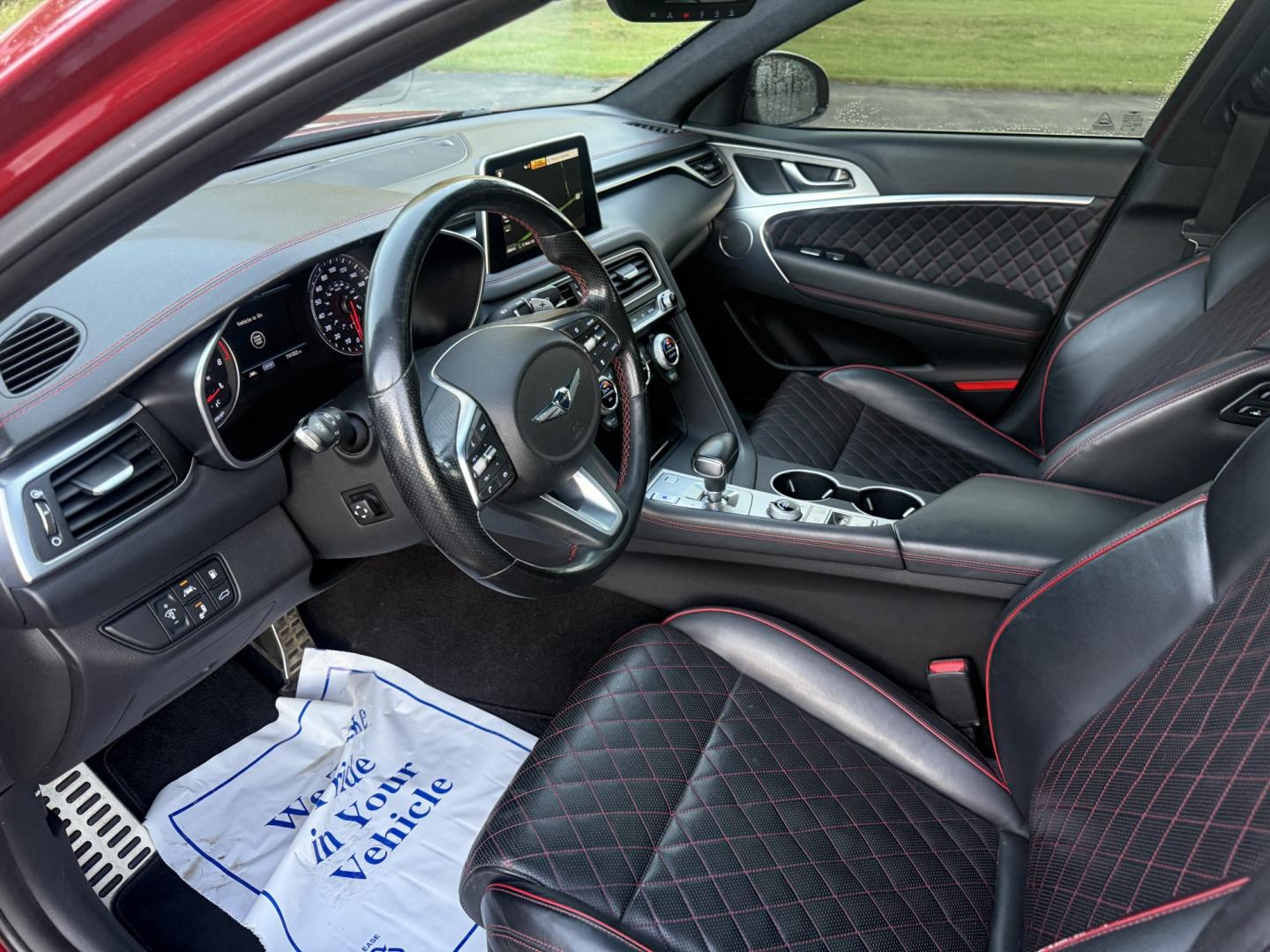 2019 Red /Black Genesis G70 Advance AWD (KMTG44LA2KU) with an 2.0L I4 DOHC 16V Turbo engine, Automatic transmission, located at 547 E. Main St., Orwell, OH, 44076, (440) 437-5893, 41.535435, -80.847855 - 2019 Genesis G70 Advance AWD – The Sedan That Makes the Drive Feel Like the Point Some cars get you there. This one makes you look forward to the trip. The 2019 Genesis G70 Advance AWD was built to go after the German sport sedans, and it has the presence to match. Finished in Havana Red on 19" g- Photo#7