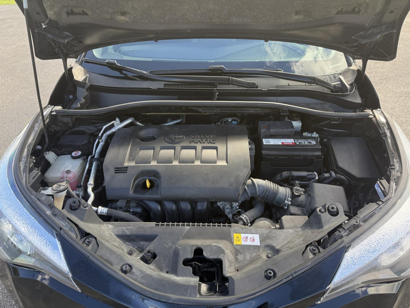 2021 Black /Black Toyota C-HR XLE (JTNKHMBX4M1) with an 2.0L I4 DOHC 16V engine, Automatic transmission, located at 11115 Chardon Rd. , Chardon, OH, 44024, (440) 214-9705, 41.580246, -81.241943 - 2021 Toyota C-HR XLE – One-Owner, Black Sand Pearl, and Built to Be Easy to Love! This 2021 Toyota C-HR XLE is the kind of one-owner crossover that makes daily driving feel simple and sharp. The XLE trim brings the comfort and safety most people actually use, wrapped in Toyota’s reputation for- Photo#6