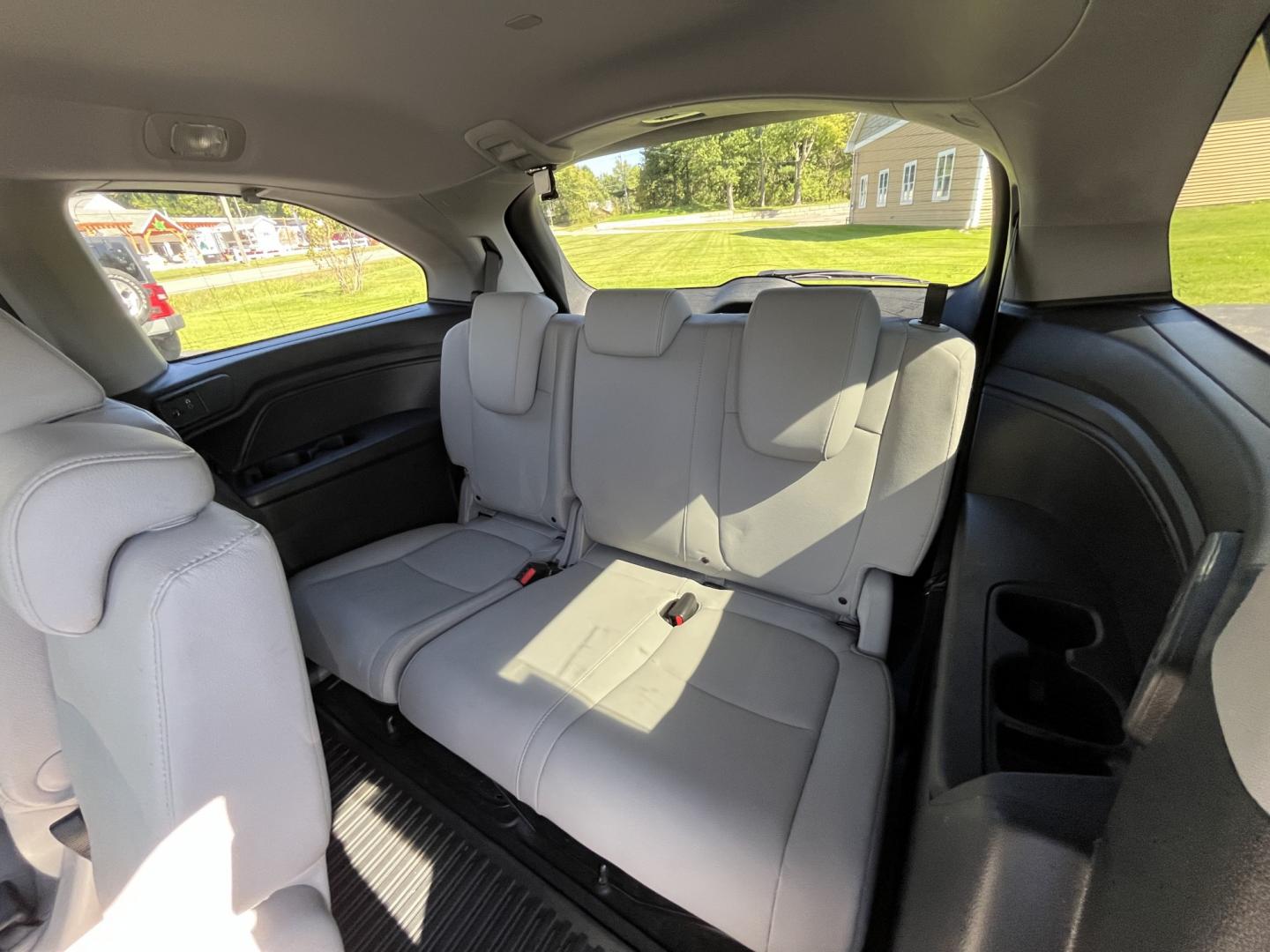 2019 Blue /Gray Honda Odyssey EX-L NAV RES (5FNRL6H71KB) with an 3.5L V6 SOHC 24V engine, Automatic transmission, located at 11115 Chardon Rd. , Chardon, OH, 44024, (440) 214-9705, 41.580246, -81.241943 - 2019 Honda Odyssey EX-L with Navigation and Rear Entertainment – Family Luxury That Makes the Miles Easier If you want a minivan that feels a step above and still handles real family life, this 2019 Honda Odyssey EX-L is a strong choice. Honda’s reputation for reliability meets a cabin built ar- Photo#38