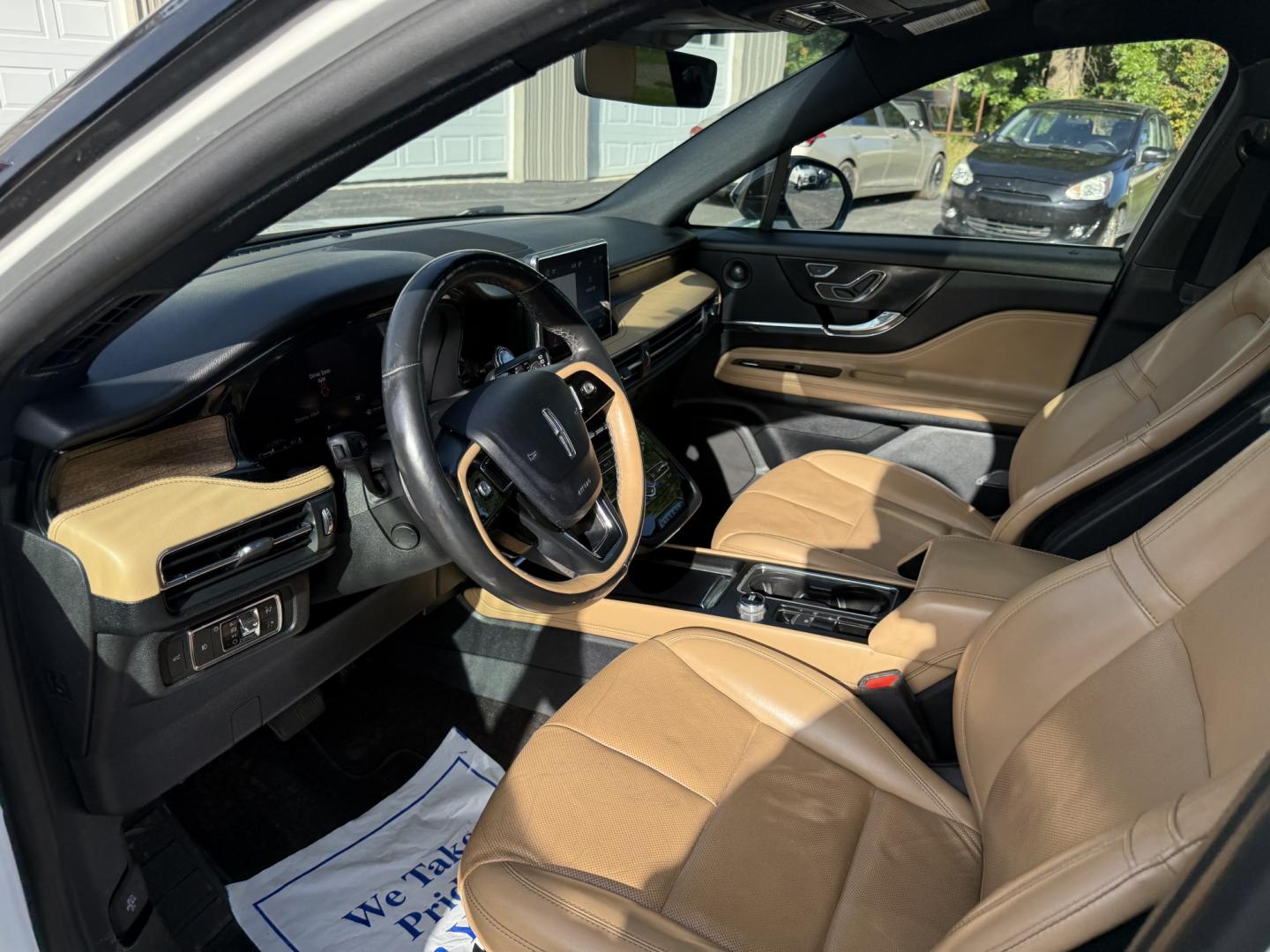 2021 White /Brown Lincoln Corsair Reserve AWD (5LMCJ2D98MU) with an 2.0L I4 DOHC 16V Turbo engine, Automatic transmission, located at 547 E. Main St., Orwell, OH, 44076, (440) 437-5893, 41.535435, -80.847855 - 2021 Lincoln Corsair Reserve AWD – Quiet Luxury in a Smaller, More Exclusive Package Lincoln is not a volume brand, and this 2021 Corsair Reserve AWD feels like it. Finished in Pristine White on 19" aluminum wheels, with full LED exterior lighting, it has the clean, composed presence of a luxury- Photo#7