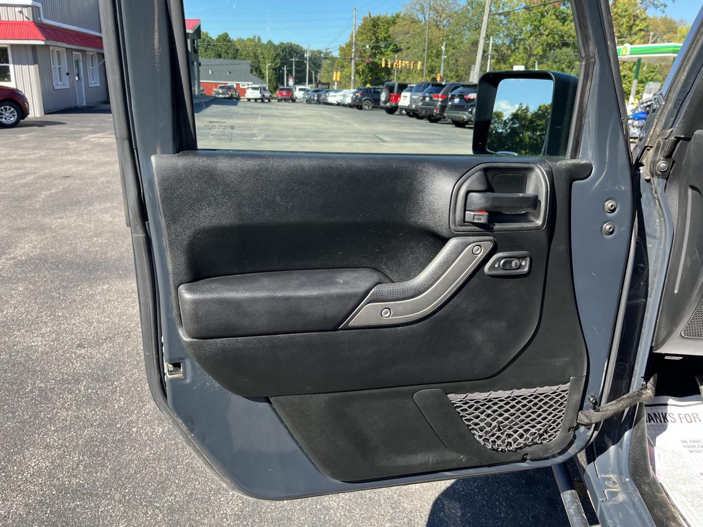 2018 Gray /Black Jeep Wrangler Unlimited Sport 4WD (1C4BJWDG3JL) with an 3.6L V6 DOHC 24V engine, Automatic transmission, located at 11115 Chardon Rd. , Chardon, OH, 44024, (440) 214-9705, 41.580246, -81.241943 - 2018 Jeep Wrangler JK Unlimited Sport 4x4 – Trail-Rated Freedom with One-Owner History This is the Jeep that still feels like a Jeep. The 2018 Wrangler JK Unlimited Sport 4x4 has the open-air character and Trail Rated capability buyers look for, with the extra room of the four-door Unlimited. Fin- Photo#16