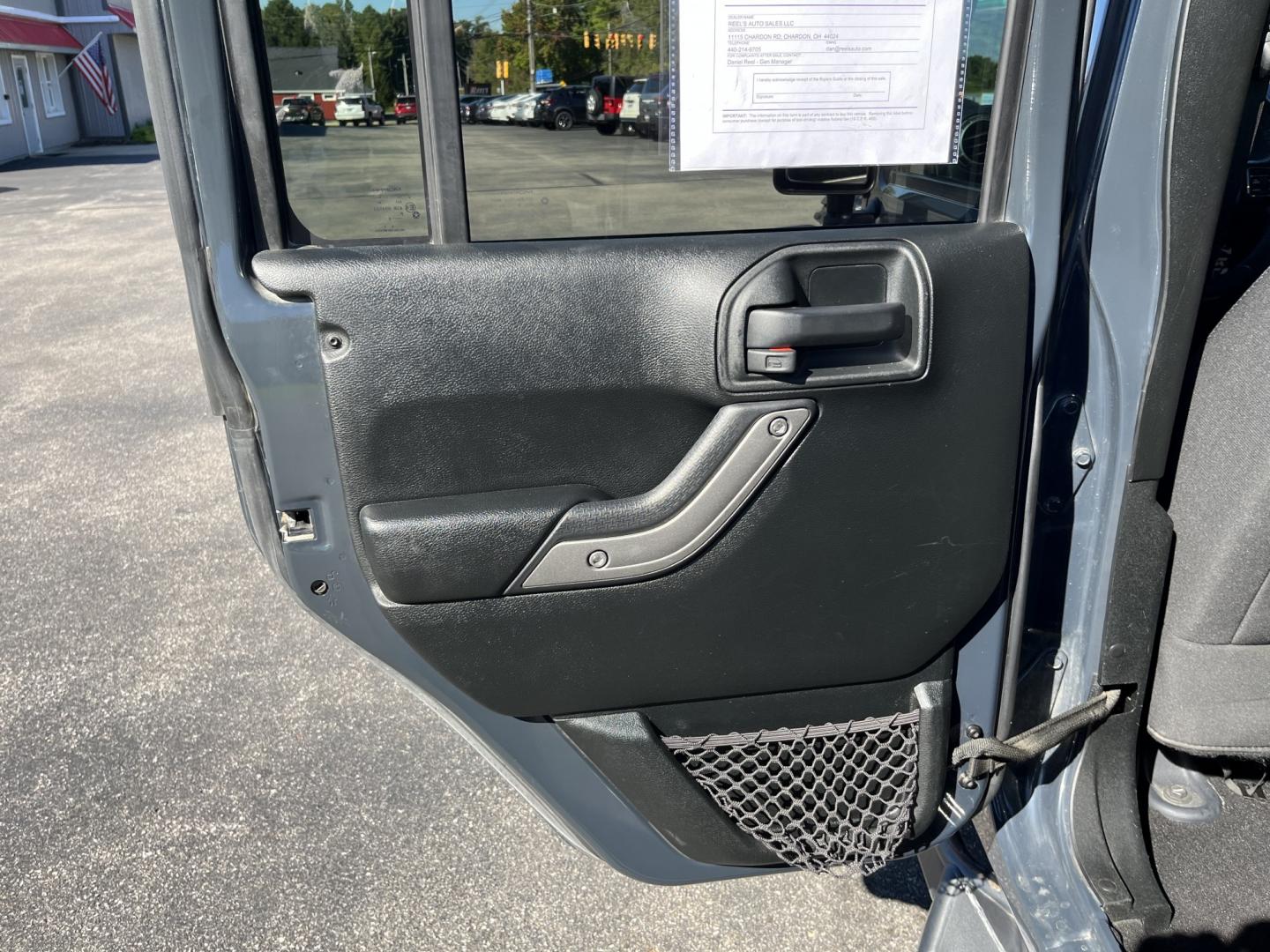 2018 Gray /Black Jeep Wrangler Unlimited Sport 4WD (1C4BJWDG3JL) with an 3.6L V6 DOHC 24V engine, Automatic transmission, located at 11115 Chardon Rd. , Chardon, OH, 44024, (440) 214-9705, 41.580246, -81.241943 - 2018 Jeep Wrangler JK Unlimited Sport 4x4 – Trail-Rated Freedom with One-Owner History This is the Jeep that still feels like a Jeep. The 2018 Wrangler JK Unlimited Sport 4x4 has the open-air character and Trail Rated capability buyers look for, with the extra room of the four-door Unlimited. Fin- Photo#28