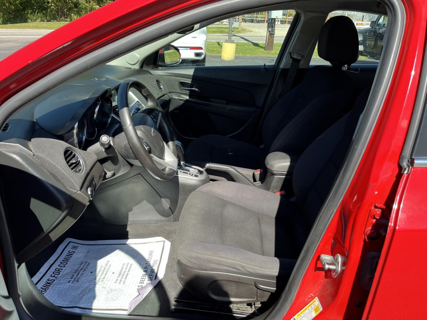2013 Red /Black Chevrolet Cruze 1LT Auto (1G1PC5SBXD7) with an 1.4L I4 DOHC 16V TURBO engine, Automatic transmission, located at 11115 Chardon Rd. , Chardon, OH, 44024, (440) 214-9705, 41.580246, -81.241943 - 2013 Chevrolet Cruze LT – Efficient Compact Sedan with Everyday Convenience If you want a smaller sedan that is easy on fuel and easy to live with, this 2013 Chevrolet Cruze LT is a practical choice. The 1.4L Turbocharged EcoTec engine and 6-speed automatic deliver smooth everyday power and a str- Photo#17