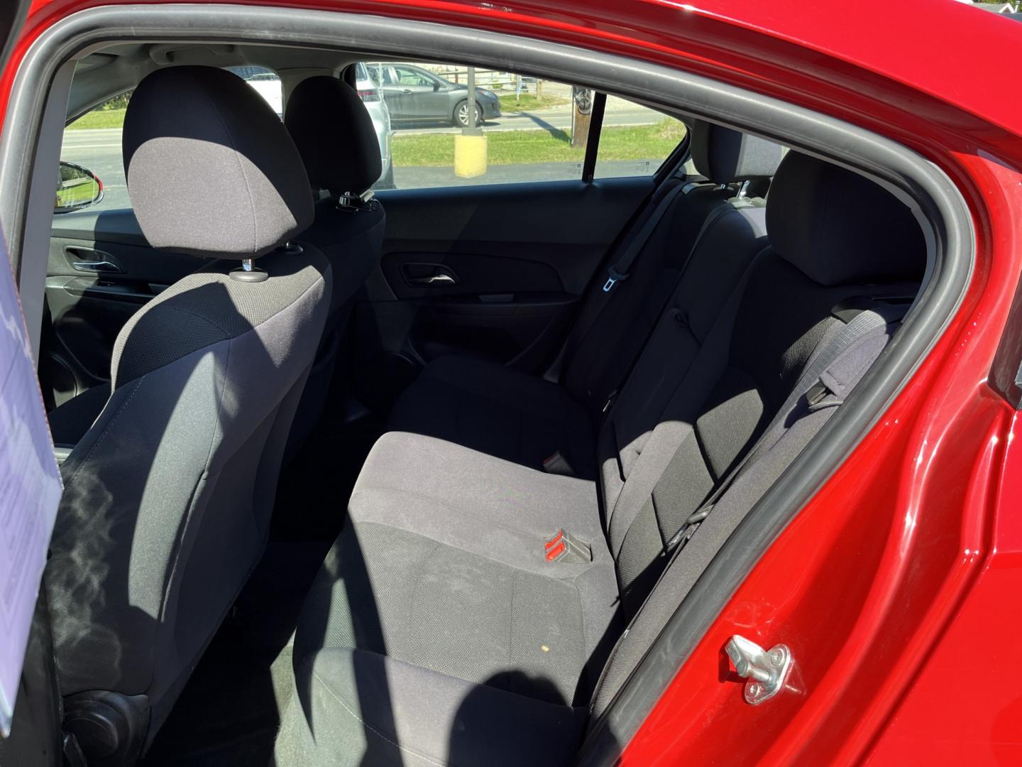 2013 Red /Black Chevrolet Cruze 1LT Auto (1G1PC5SBXD7) with an 1.4L I4 DOHC 16V TURBO engine, Automatic transmission, located at 11115 Chardon Rd. , Chardon, OH, 44024, (440) 214-9705, 41.580246, -81.241943 - 2013 Chevrolet Cruze LT – Efficient Compact Sedan with Everyday Convenience If you want a smaller sedan that is easy on fuel and easy to live with, this 2013 Chevrolet Cruze LT is a practical choice. The 1.4L Turbocharged EcoTec engine and 6-speed automatic deliver smooth everyday power and a str- Photo#30