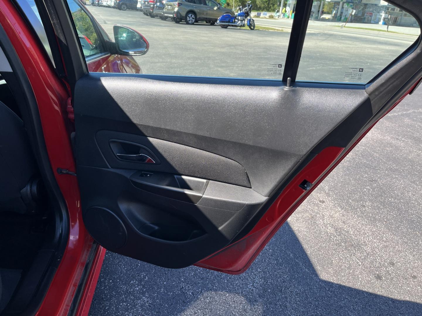 2013 Red /Black Chevrolet Cruze 1LT Auto (1G1PC5SBXD7) with an 1.4L I4 DOHC 16V TURBO engine, Automatic transmission, located at 11115 Chardon Rd. , Chardon, OH, 44024, (440) 214-9705, 41.580246, -81.241943 - 2013 Chevrolet Cruze LT – Efficient Compact Sedan with Everyday Convenience If you want a smaller sedan that is easy on fuel and easy to live with, this 2013 Chevrolet Cruze LT is a practical choice. The 1.4L Turbocharged EcoTec engine and 6-speed automatic deliver smooth everyday power and a str- Photo#32