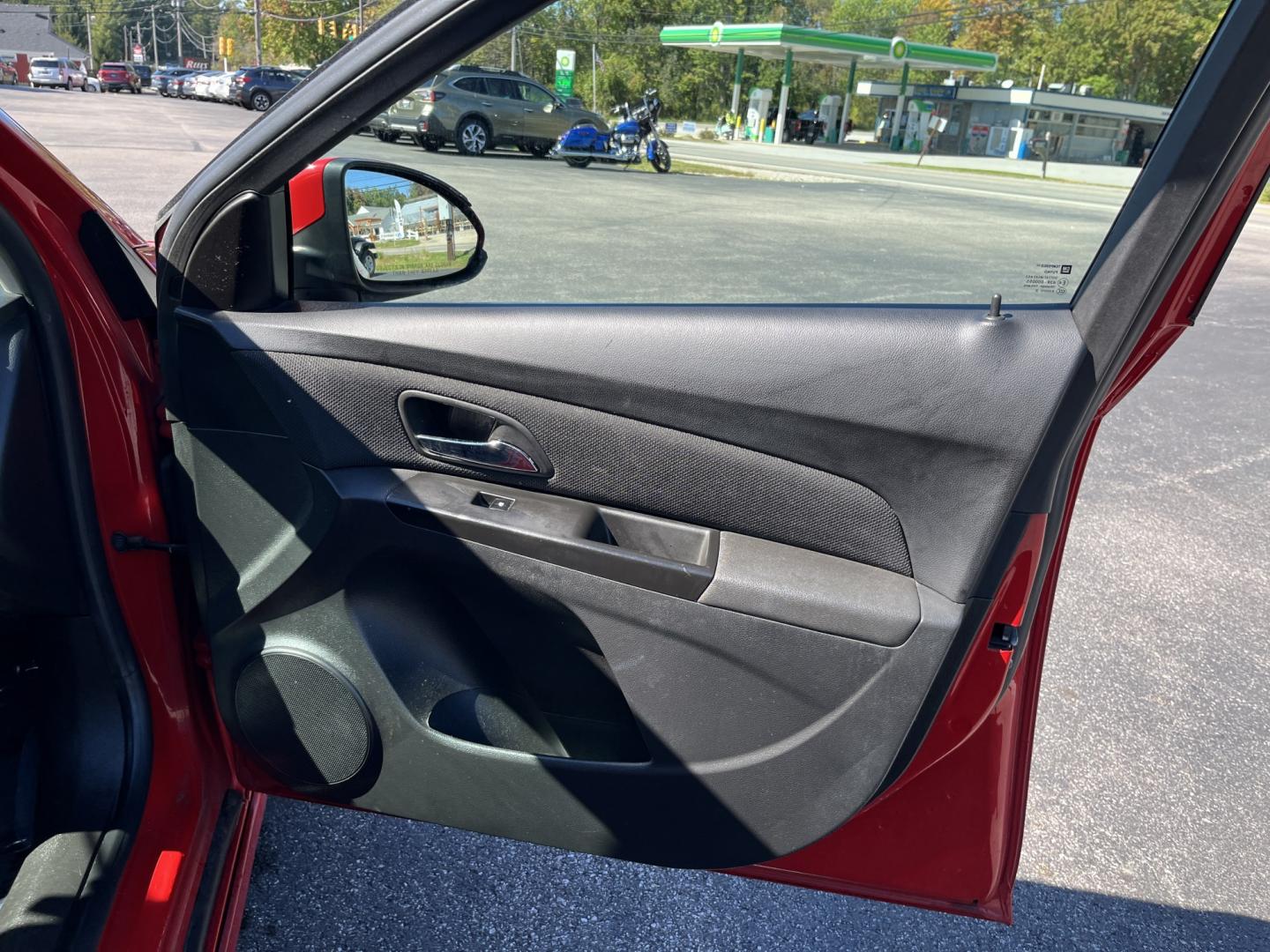 2013 Red /Black Chevrolet Cruze 1LT Auto (1G1PC5SBXD7) with an 1.4L I4 DOHC 16V TURBO engine, Automatic transmission, located at 11115 Chardon Rd. , Chardon, OH, 44024, (440) 214-9705, 41.580246, -81.241943 - 2013 Chevrolet Cruze LT – Efficient Compact Sedan with Everyday Convenience If you want a smaller sedan that is easy on fuel and easy to live with, this 2013 Chevrolet Cruze LT is a practical choice. The 1.4L Turbocharged EcoTec engine and 6-speed automatic deliver smooth everyday power and a str- Photo#34
