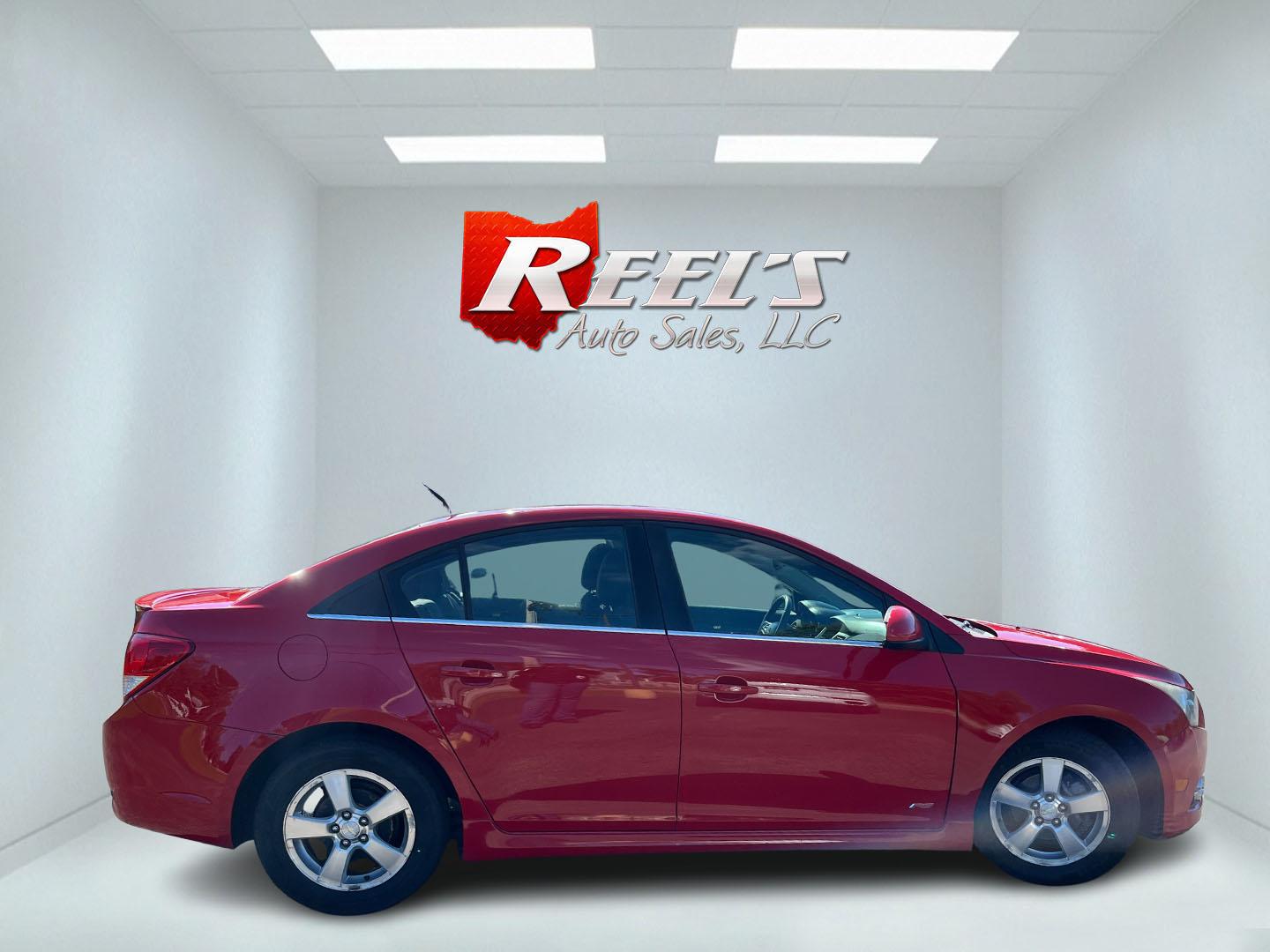 2013 Red /Black Chevrolet Cruze 1LT Auto (1G1PC5SBXD7) with an 1.4L I4 DOHC 16V TURBO engine, Automatic transmission, located at 11115 Chardon Rd. , Chardon, OH, 44024, (440) 214-9705, 41.580246, -81.241943 - 2013 Chevrolet Cruze LT – Efficient Compact Sedan with Everyday Convenience If you want a smaller sedan that is easy on fuel and easy to live with, this 2013 Chevrolet Cruze LT is a practical choice. The 1.4L Turbocharged EcoTec engine and 6-speed automatic deliver smooth everyday power and a str- Photo#5