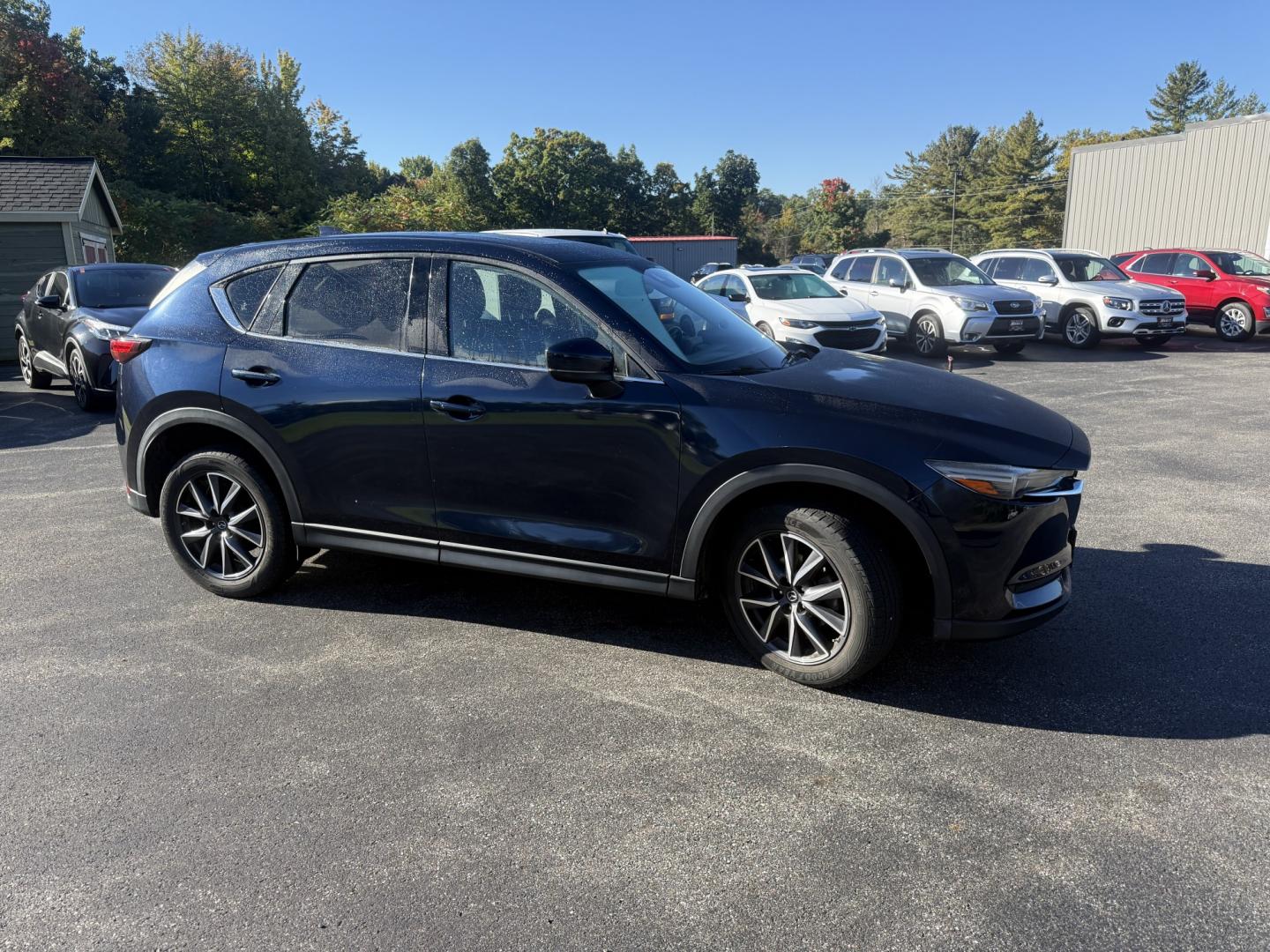 2018 Blue /Black Mazda CX-5 Grand Touring AWD (JM3KFBDM9J0) with an 2.5L I4 DOHC 16V engine, Automatc transmission, located at 11115 Chardon Rd. , Chardon, OH, 44024, (440) 214-9705, 41.580246, -81.241943 - 2018 Mazda CX-5 Grand Touring AWD – Deep Crystal Blue, Bose Sound, and That Signature Mazda Drive! This 2018 Mazda CX-5 Grand Touring AWD is the trim that makes a daily crossover feel special. Grand Touring is Mazda’s upscale statement: leather, memory seats, a power liftgate, and the kind of c- Photo#3