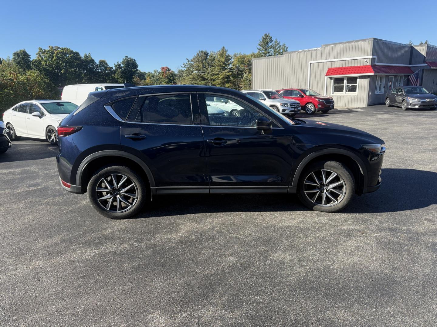 2018 Blue /Black Mazda CX-5 Grand Touring AWD (JM3KFBDM9J0) with an 2.5L I4 DOHC 16V engine, Automatc transmission, located at 11115 Chardon Rd. , Chardon, OH, 44024, (440) 214-9705, 41.580246, -81.241943 - 2018 Mazda CX-5 Grand Touring AWD – Deep Crystal Blue, Bose Sound, and That Signature Mazda Drive! This 2018 Mazda CX-5 Grand Touring AWD is the trim that makes a daily crossover feel special. Grand Touring is Mazda’s upscale statement: leather, memory seats, a power liftgate, and the kind of c- Photo#25