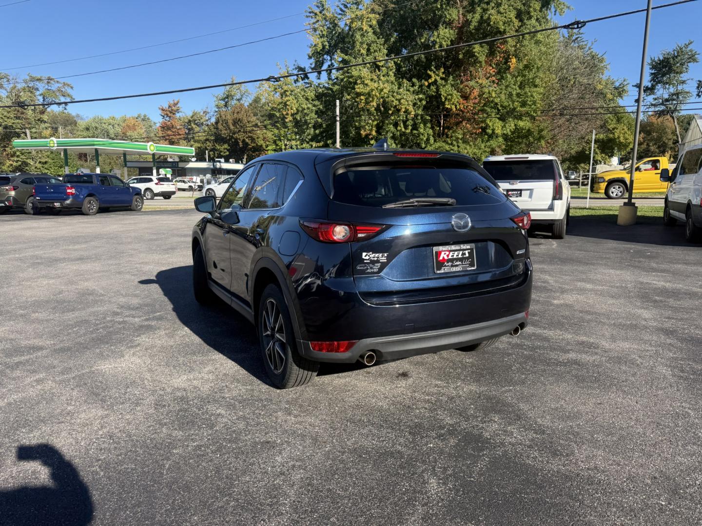 2018 Blue /Black Mazda CX-5 Grand Touring AWD (JM3KFBDM9J0) with an 2.5L I4 DOHC 16V engine, Automatc transmission, located at 11115 Chardon Rd. , Chardon, OH, 44024, (440) 214-9705, 41.580246, -81.241943 - 2018 Mazda CX-5 Grand Touring AWD – Deep Crystal Blue, Bose Sound, and That Signature Mazda Drive! This 2018 Mazda CX-5 Grand Touring AWD is the trim that makes a daily crossover feel special. Grand Touring is Mazda’s upscale statement: leather, memory seats, a power liftgate, and the kind of c- Photo#35