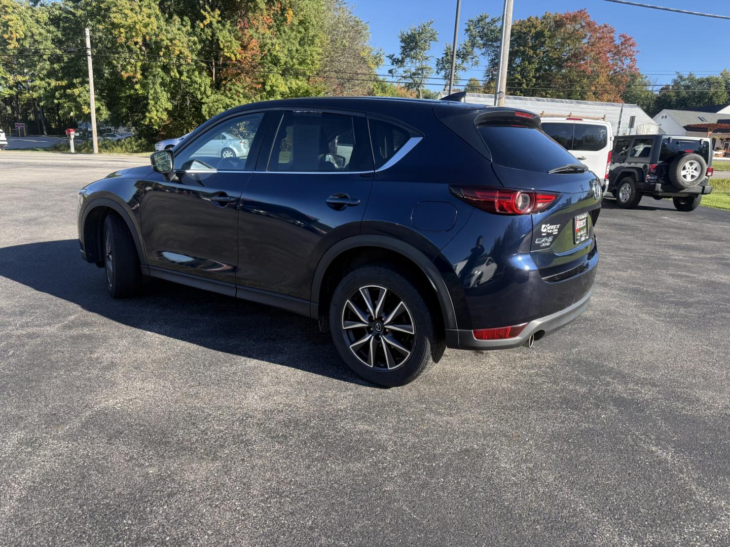 2018 Blue /Black Mazda CX-5 Grand Touring AWD (JM3KFBDM9J0) with an 2.5L I4 DOHC 16V engine, Automatc transmission, located at 11115 Chardon Rd. , Chardon, OH, 44024, (440) 214-9705, 41.580246, -81.241943 - 2018 Mazda CX-5 Grand Touring AWD – Deep Crystal Blue, Bose Sound, and That Signature Mazda Drive! This 2018 Mazda CX-5 Grand Touring AWD is the trim that makes a daily crossover feel special. Grand Touring is Mazda’s upscale statement: leather, memory seats, a power liftgate, and the kind of c- Photo#36