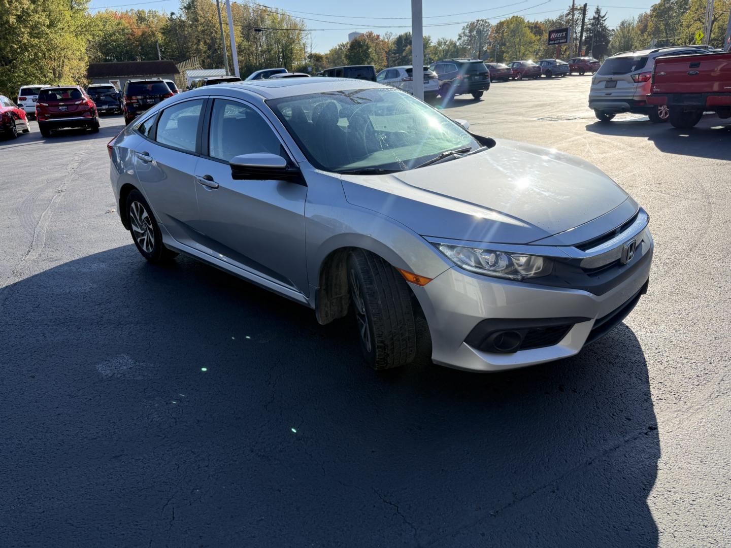 2017 Silver /Black Honda Civic EX Honda Sensing Sedan CVT (19XFC2F86HE) with an 2.0L I4 DOHC 16V engine, Automatic transmission, located at 547 E. Main St., Orwell, OH, 44076, (440) 437-5893, 41.535435, -80.847855 - 2017 Honda Civic EX Sedan – Efficient Daily Driver with Honda Sensing This 2017 Honda Civic EX Sedan is finished in Lunar Silver Metallic on 16" alloy wheels, with daytime running lights and dusk-sensing headlights. It has the clean, practical look the Civic is known for. The 2.0L K20 engine deli- Photo#2