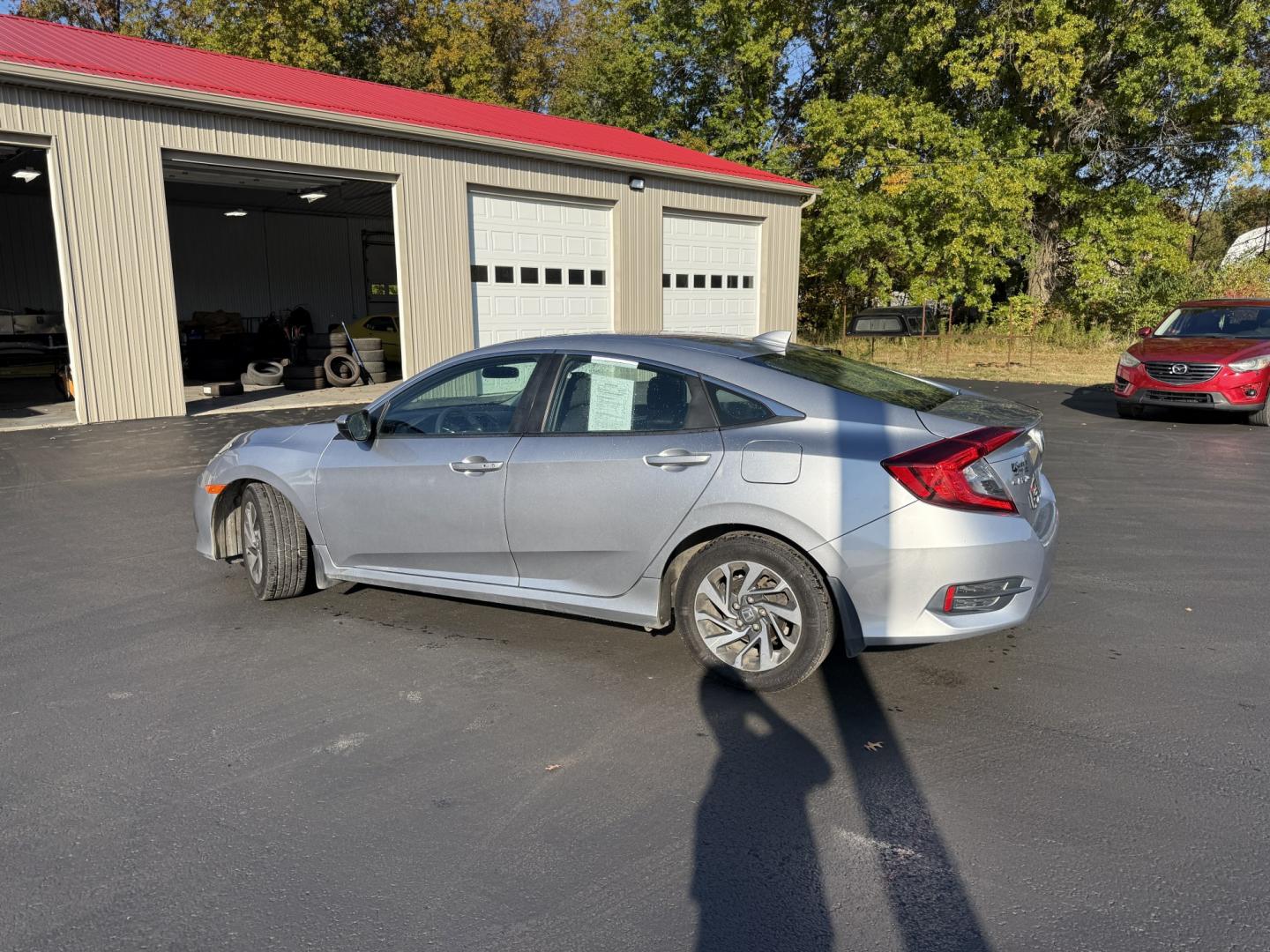 2017 Silver /Black Honda Civic EX Honda Sensing Sedan CVT (19XFC2F86HE) with an 2.0L I4 DOHC 16V engine, Automatic transmission, located at 547 E. Main St., Orwell, OH, 44076, (440) 437-5893, 41.535435, -80.847855 - 2017 Honda Civic EX Sedan – Efficient Daily Driver with Honda Sensing This 2017 Honda Civic EX Sedan is finished in Lunar Silver Metallic on 16" alloy wheels, with daytime running lights and dusk-sensing headlights. It has the clean, practical look the Civic is known for. The 2.0L K20 engine deli- Photo#29