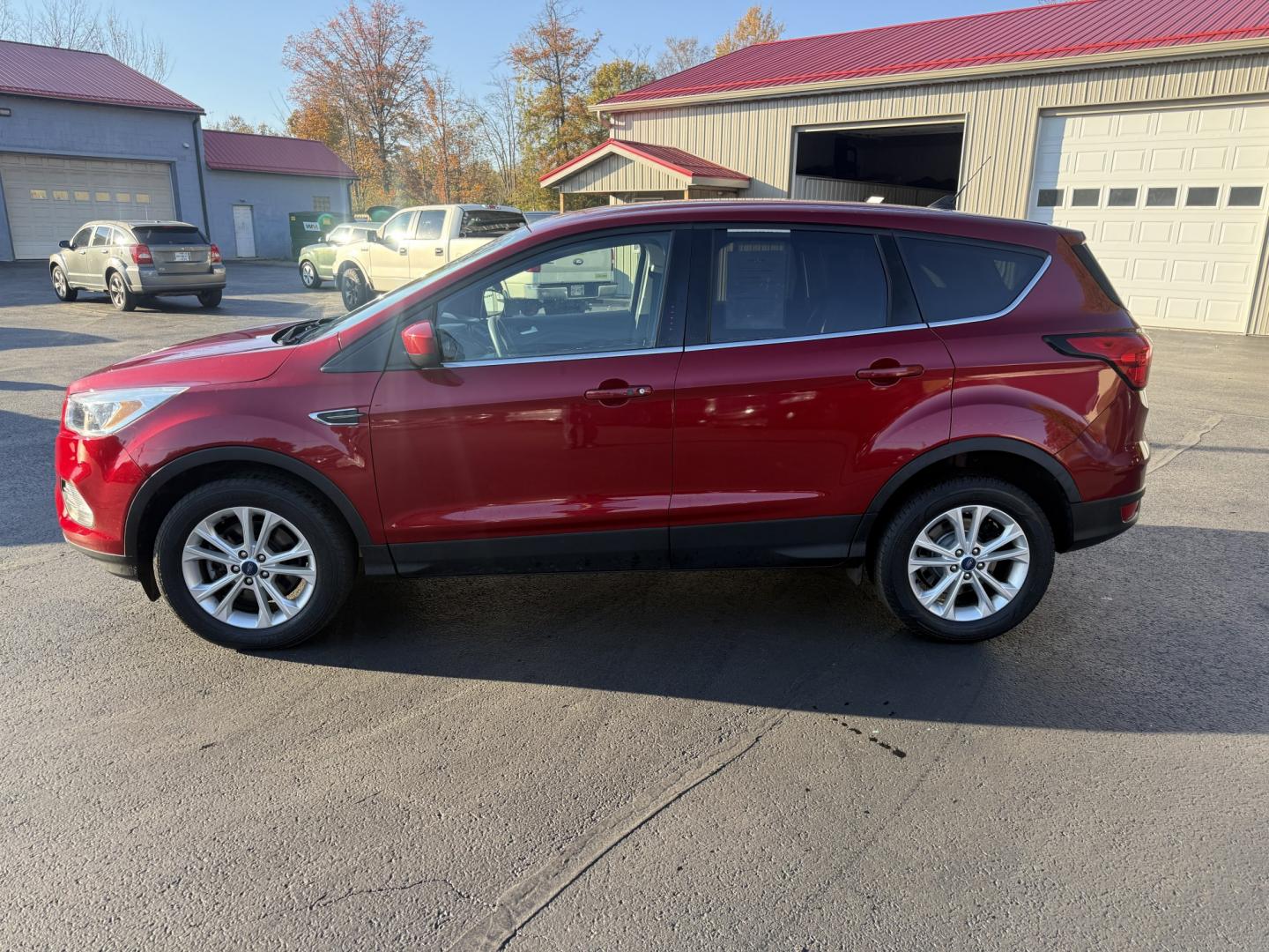 2019 Red /Black Ford Escape SE 4WD (1FMCU9GD3KU) with an 1.5L I4 DOHC 16V TURBO engine, Automatic transmission, located at 547 E. Main St., Orwell, OH, 44076, (440) 437-5893, 41.535435, -80.847855 - 2019 Ford Escape SE 4WD – Practical Compact Crossover with EcoBoost Efficiency - One Owner Carfax This 2019 Ford Escape SE 4WD is finished in Ruby Red Metallic on 17" aluminum wheels, with daytime running lights and dusk-sensing headlights. It keeps a clean, everyday look. The 1.5L turbocharged E- Photo#29