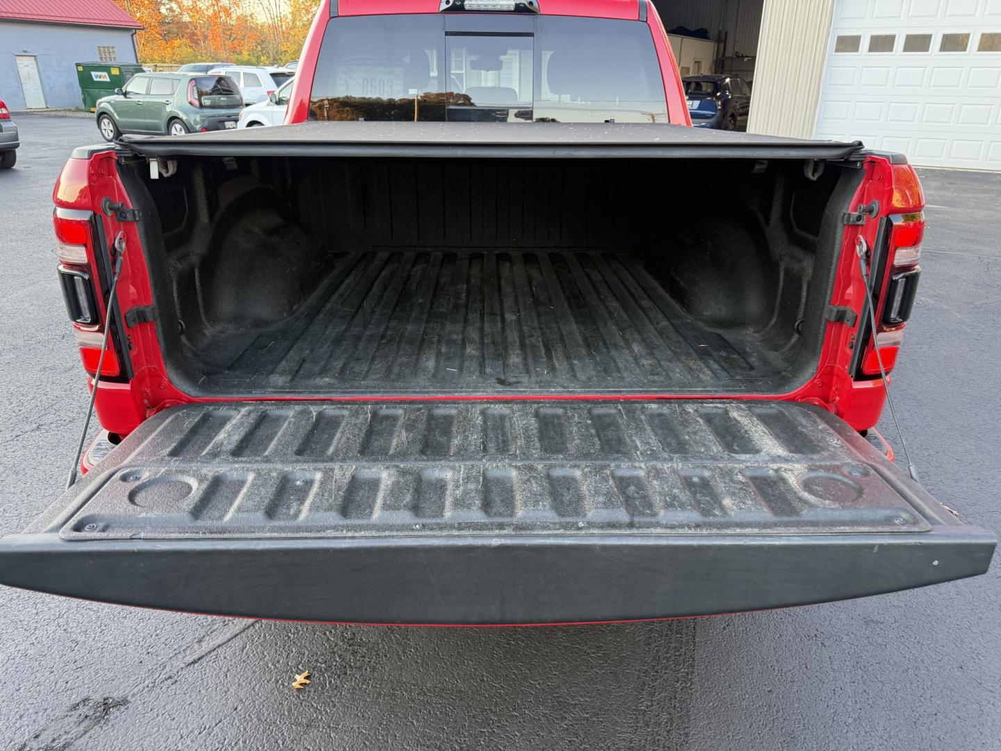 2021 Red /Black Ram 1500 Big Horn Crew Cab SWB 4WD (1C6SRFFT9MN) with an 5.7L V8 OHV 16V engine, 8A transmission, located at 547 E. Main St., Orwell, OH, 44076, (440) 437-5893, 41.535435, -80.847855 - 2021 Ram 1500 Big Horn Crew Cab 4WD – Night Edition Look That Stands Out This 2021 Ram 1500 Big Horn Crew Cab 4WD is finished in Flame Red with the Night Edition package and 20" black aluminum wheels. The blacked-out wheels, full LED exterior lighting, and clean one-owner Carfax history give it a- Photo#9