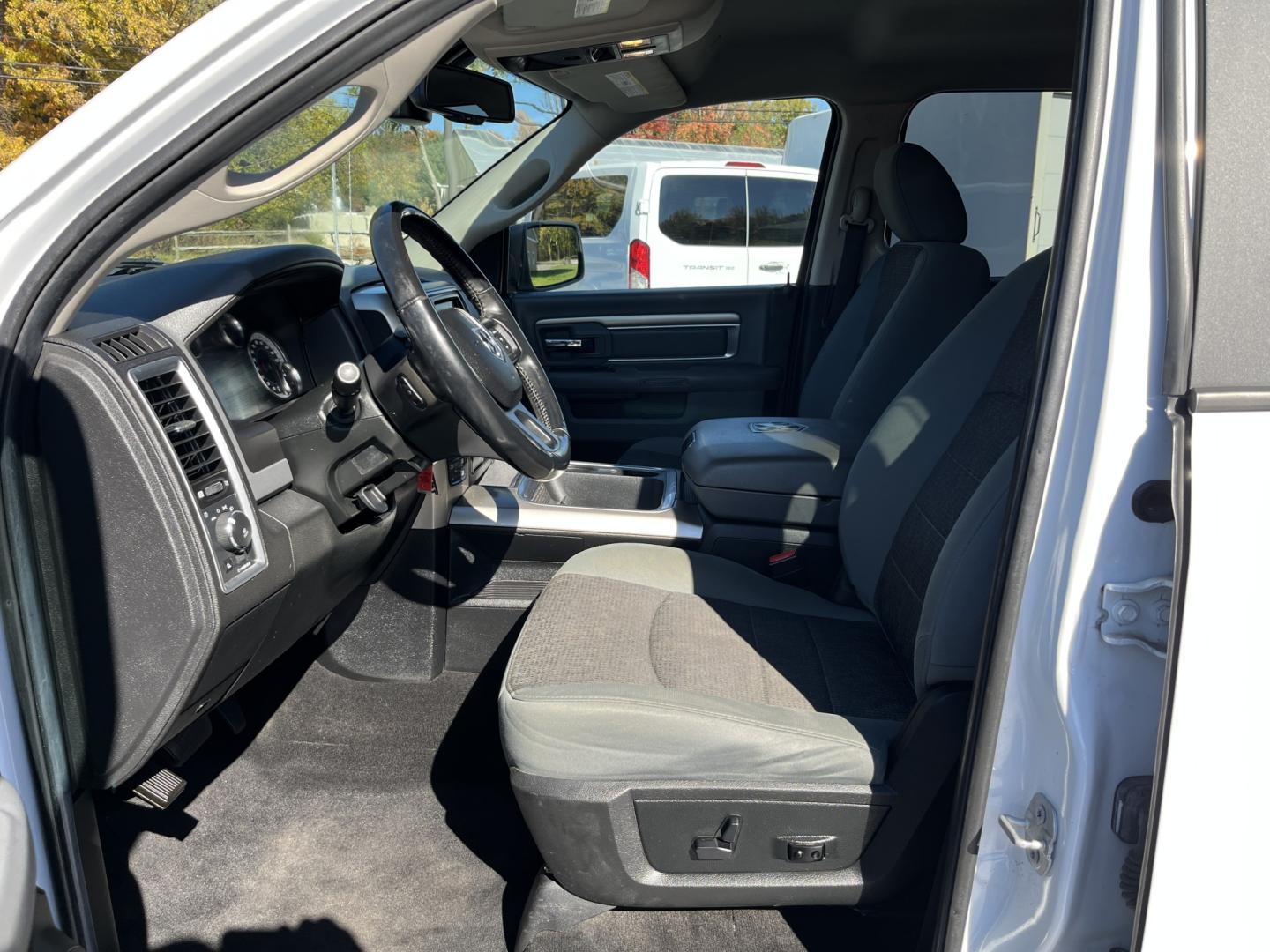 2017 White /Gray Ram 1500 Big Horn Crew Cab SWB 4WD (1C6RR7LG1HS) with an 3.6L V6 DOHC 24V FFV engine, Automatic transmission, located at 11115 Chardon Rd. , Chardon, OH, 44024, (440) 214-9705, 41.580246, -81.241943 - 2017 Ram 1500 Big Horn Crew Cab 4WD – Practical V6 with Heated Seats and Chrome Wheels This 2017 Ram 1500 Big Horn Crew Cab 4WD is finished in Bright White on 20" chrome wheels, with daytime running lights and dusk-sensing headlights. It has a clean, straightforward look. The 3.6L Pentastar V6 an- Photo#17